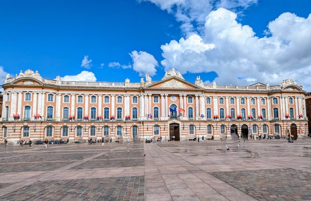 Things to do in Toulouse - The Capitole de Toulouse - a pink building in the centre. The Toulouse parliament building. Go inside, to Salle des Illustres - with its grand marble and pillars.